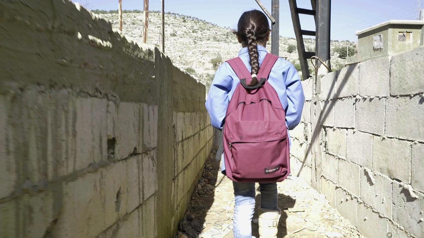 Bara’a, 10, originally from Ghouta, Syria, leaves for school from her informal refugee camp in Mount Lebanon. 