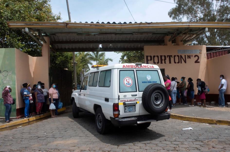  An ambulance enters the Aleman-Nicaraguense Hospital, which cares for people infected with Covid-19, as relatives of patients wait in line in Managua, Nicaragua, on June 1, 2020.