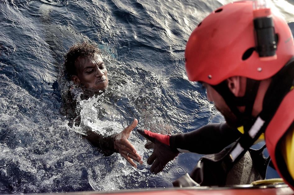 A man is rescued from the Mediterranean Sea by a member of Proactiva Open Arms NGO some 20 nautical miles north of Libya on October 3, 2016. &nbsp;© 2016 Getty Images