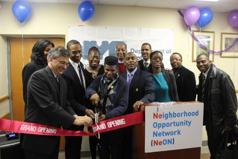Former Commissioner Vincent Schiraldi and others cut a ribbon at the opening of the Neighborhood Opportunity Network at the New York City Department of Probation. 