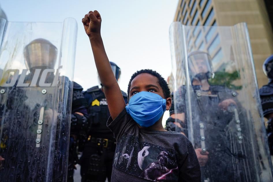 A young boy raises his fist during a demonstration in Atlanta, Georgia, May 31, 2020.