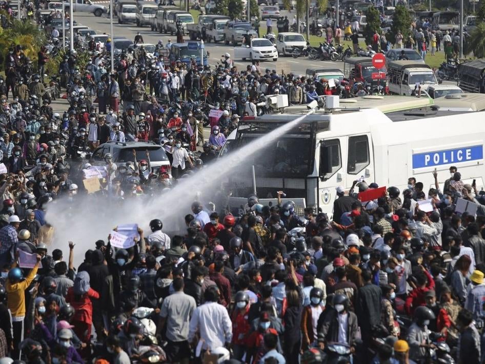 Police use a water cannon on a crowd of protesters in Naypyitaw, Myanmar on Monday, February 8, 2021.