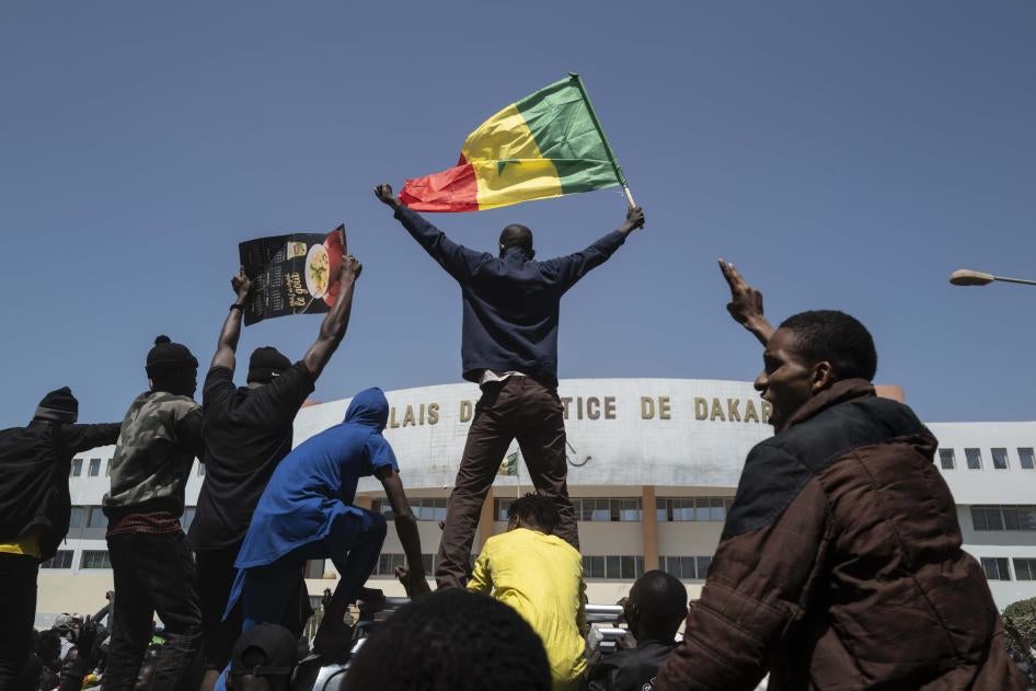 Demonstrators shout slogans during a protest against the arrest of opposition leader and former presidential candidate Ousmane Sonko near the Justice Palace of Dakar, Senegal, March 8, 2021. 