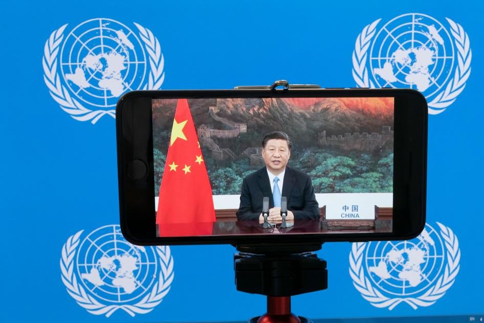 Chinese President Xi Jinping is seen on a phone screen remotely addressing the 75th session of the United Nations General Assembly, September 22, 2020. 