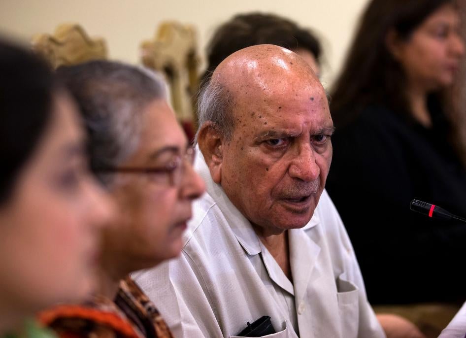 I.A. Rehman, center, addresses a news conference, in Islamabad, Pakistan, July 16, 2018.