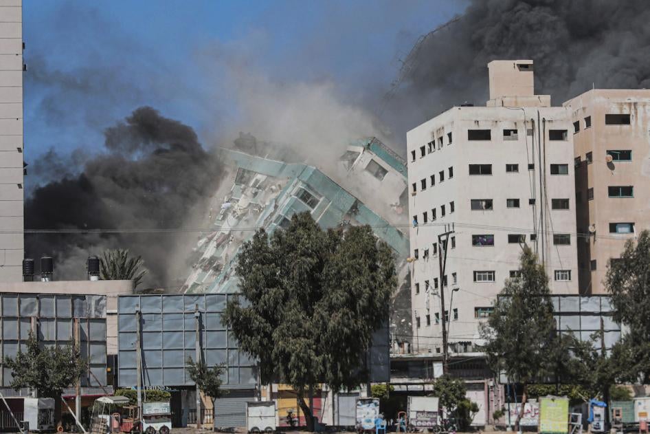 The Jala Tower as it is destroyed in an Israeli airstrike in Gaza. Israel's air force targeted the 13-floor Jala Tower housing Qatar-based Al-Jazeera television and the Associated Press news agency.