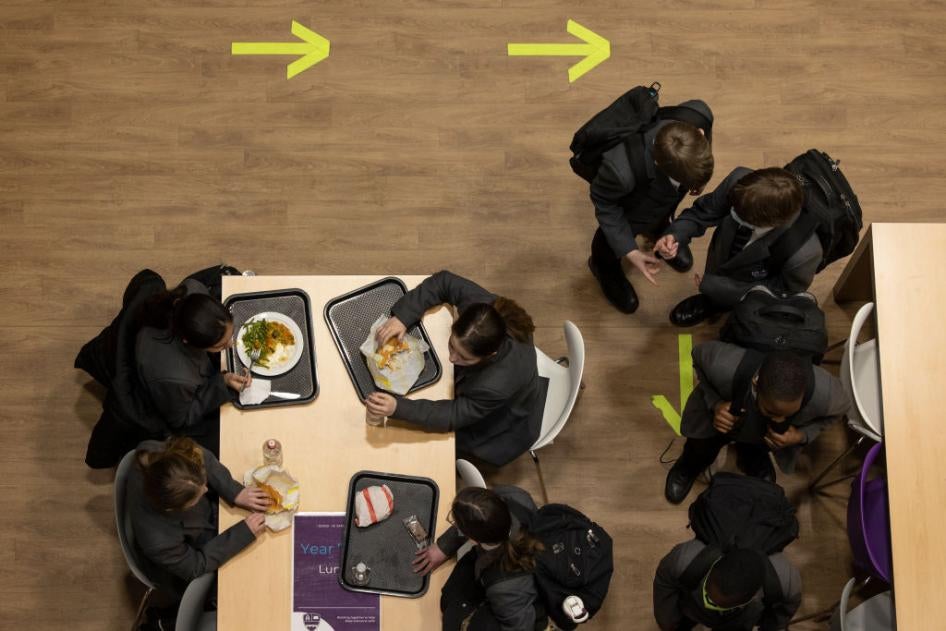 Students eat lunch at Chertsey High School on March 09, 2021 in Chertsey, United Kingdom. 