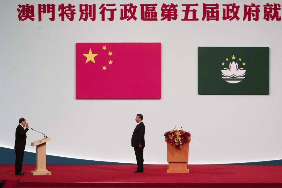 Macao Chief Executive Ho Iat Seng, left, reads his oath of office in front of Chinese leader Xi Jinping at the inauguration ceremony in Macao, December 20, 2019.