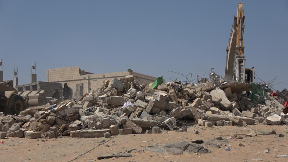 A truck searches for victims under the rubble. The house was destroyed by a Houthi missile in Al-Amoud in al-Jubah district, Marib governorate pictured on October 29, 2021.  