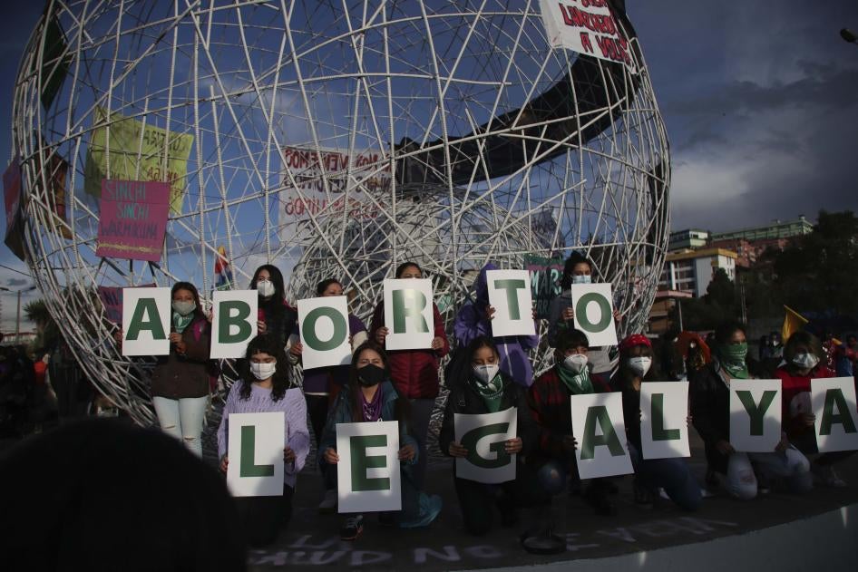 Women hold letters forming the phrase "Legal Abortion Now" during an abortion rights protest in Quito, Ecuador, Monday, September 28, 2020. 