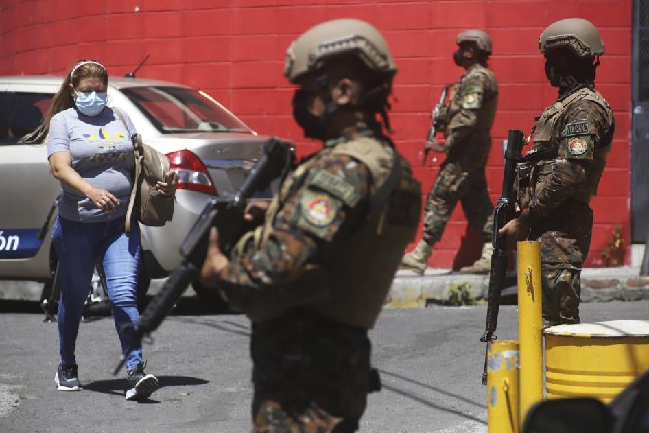 Soldiers guard a checkpoint at the entrance of the Las Palmas Community, in San Salvador, El Salvador, March 27, 2022.