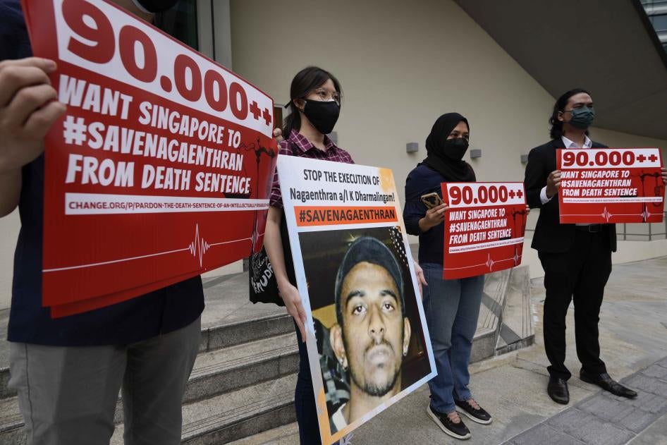 A group of people holding protest signs