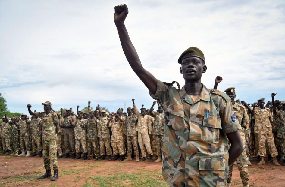 soldiers cheer at a ceremony