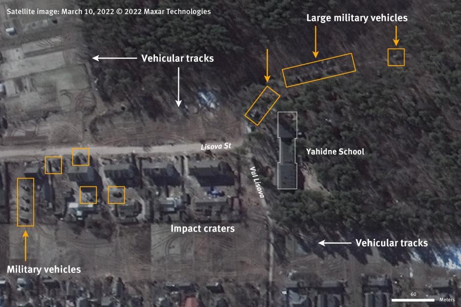 An optical very high-resolution commercial satellite image collected on March 10, 2022 shows dozens of armored and support military vehicles in the yard of and next to Yahidne school, and possibly  more in the trees surrounding the school, and large vehicle tracks throughout the village with a higher concentration at the schoolhouse. 