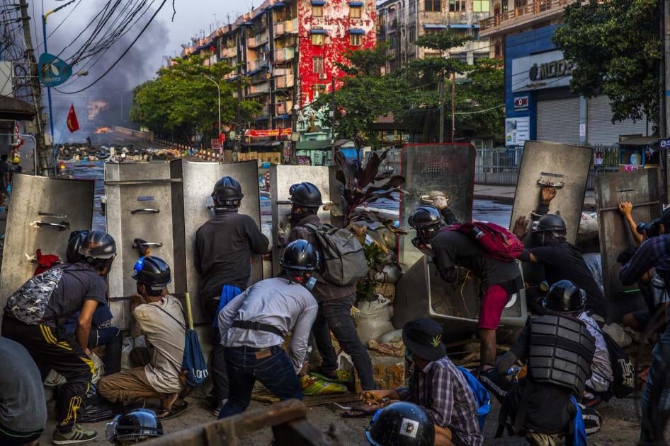 Protestors defend their makeshift barrier