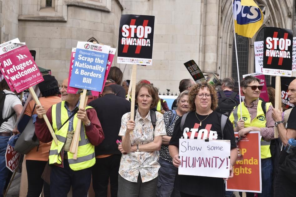 Protesters gathered opposite The Royal Courts Of Justice over UK's agreement with Rwanda. 