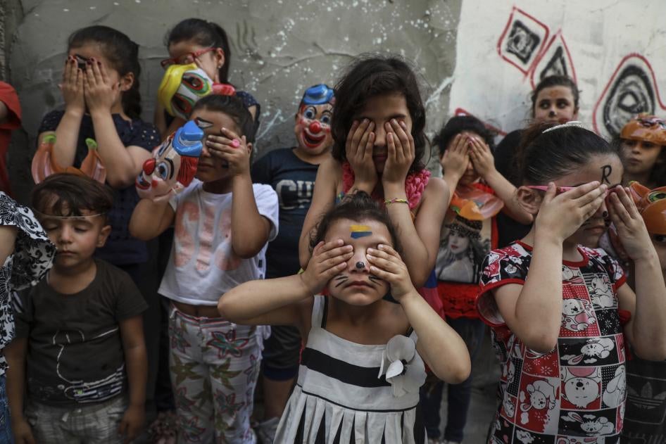 Palestinian children participate in a mental health support session.