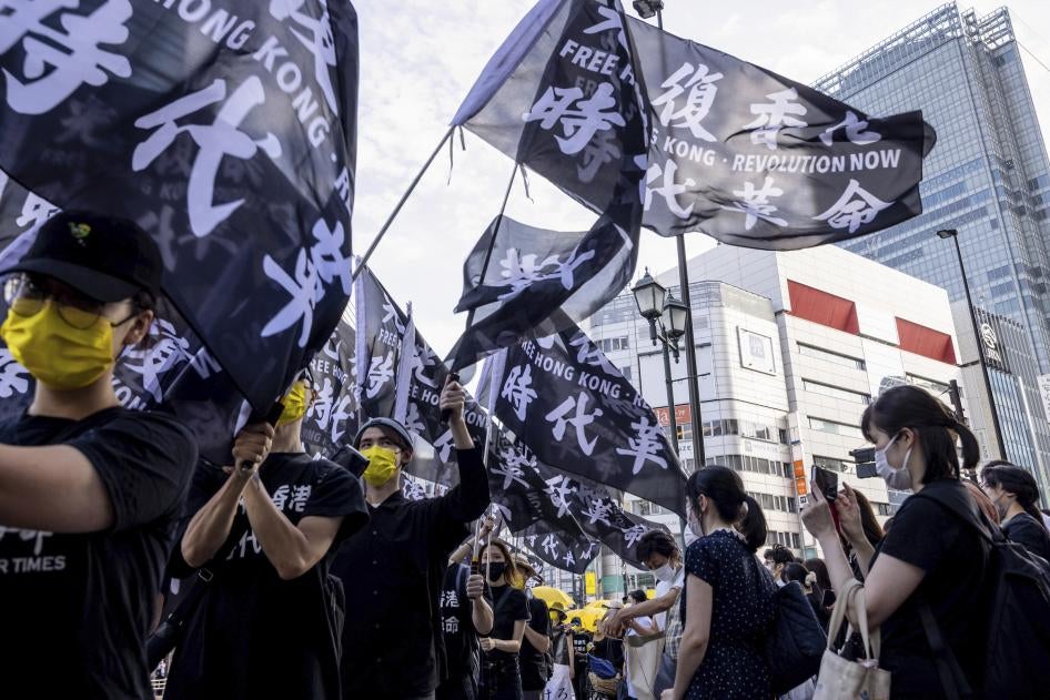 Pro-democracy demonstrators take to the streets in Shinjuku, Japan to mark the second anniversary of the anti-extradition bill movement in Hong Kong, June 12, 2021. 