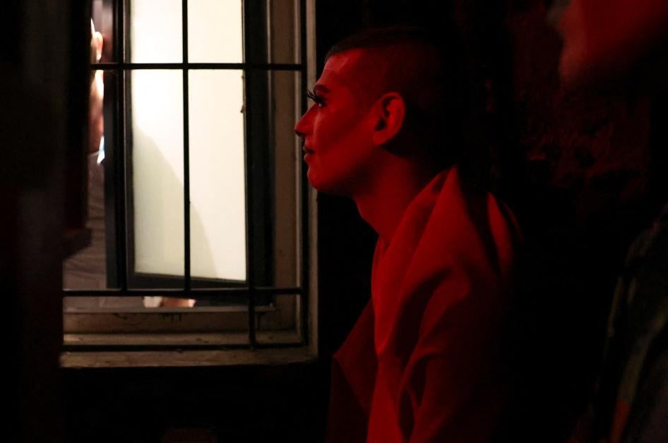 The drag artist known as Latiza Bombe hides on the terrace of a bar after it was attacked by a group of conservative Christians who identify as the “Soldiers of God,” in Beirut, Lebanon, August 23, 2023.