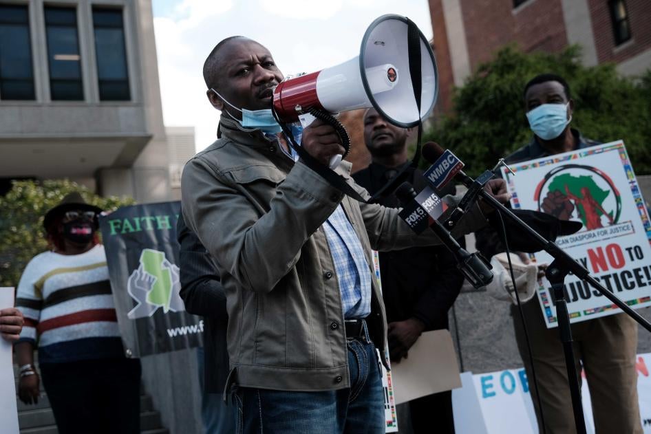 Haitian community leaders, immigrant community members, and their supporters gather on October 22, 2021 at the Newark Immigration and Customs Enforcement field office in Newark, New Jersey to demand that President Biden's administration stop deportations of Haitians. © Photo by Spencer Platt/Getty Images