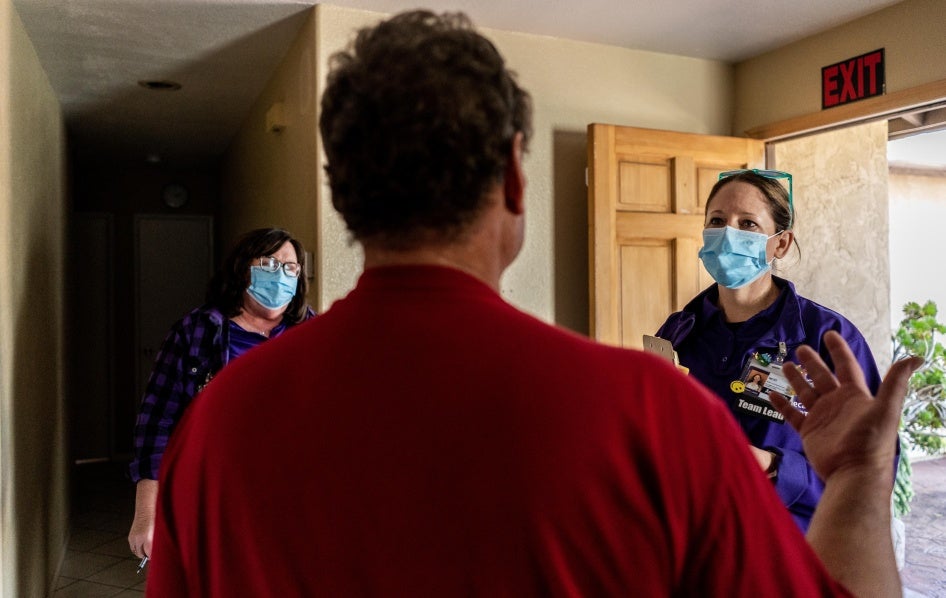 Team leads from the Mobile Crisis Response Teams, an organization that responds to behavioral health, drug, or alcohol-related situations, speak to a client during a call in San Diego, California, March 24, 2023. 