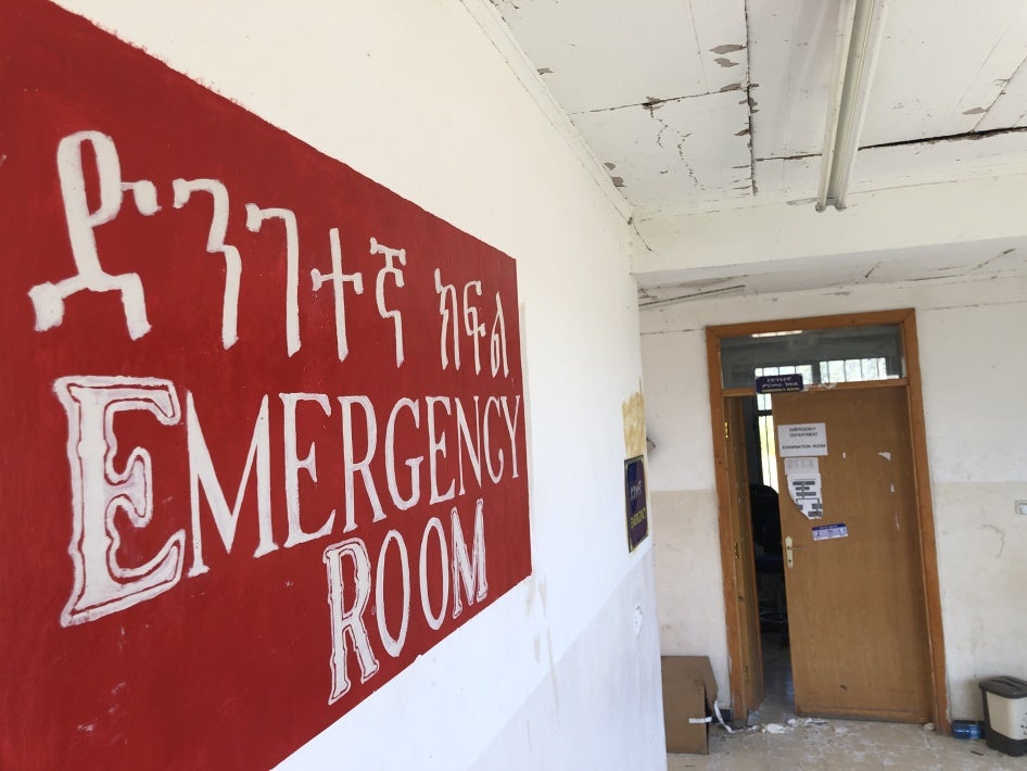 A sign that reads "Emergency Room" in a hospital 