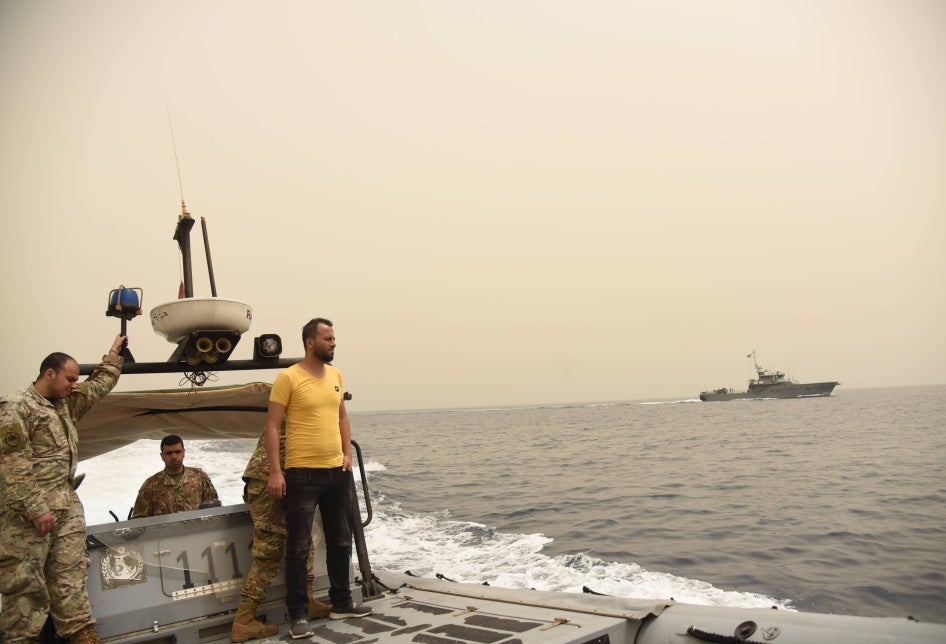 Men on a military boat at sea