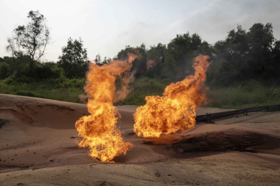 A burning flare is visible at an oil extraction area located in Moanda, Democratic Republic of the Congo, December 23, 2023.
