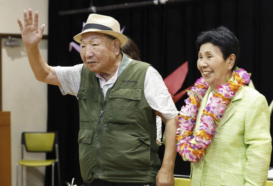 Iwao Hakamata waves to supporters while meeting with his sister Hideko, several weeks after his acquittal on retrial for the 1966 murder of a family of four, in Shizuoka, Japan, October 14, 2024.