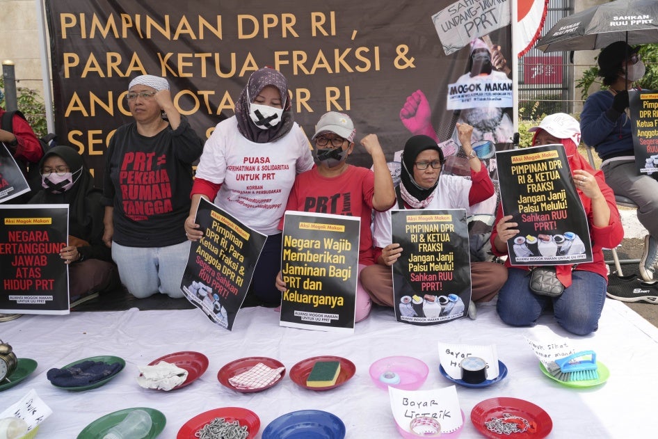 Activists during a protest and hunger strike demanding that parliament to pass a bill to protect domestic workers, at the parliament in Jakarta, Indonesia, August 14, 2023.