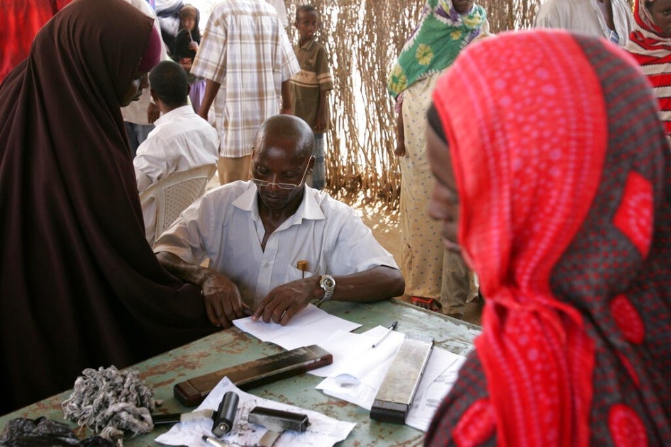 A woman has her fingerprints taken as she registers with the United Nations High Commissioner for Refugees (UNHCR) at the Liboi transit point in Kenya, near the Somali border, November 1, 2006.