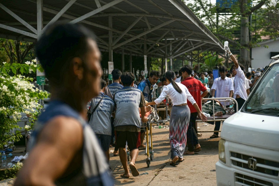 Medical workers transport an earthquake casualty at a hospital