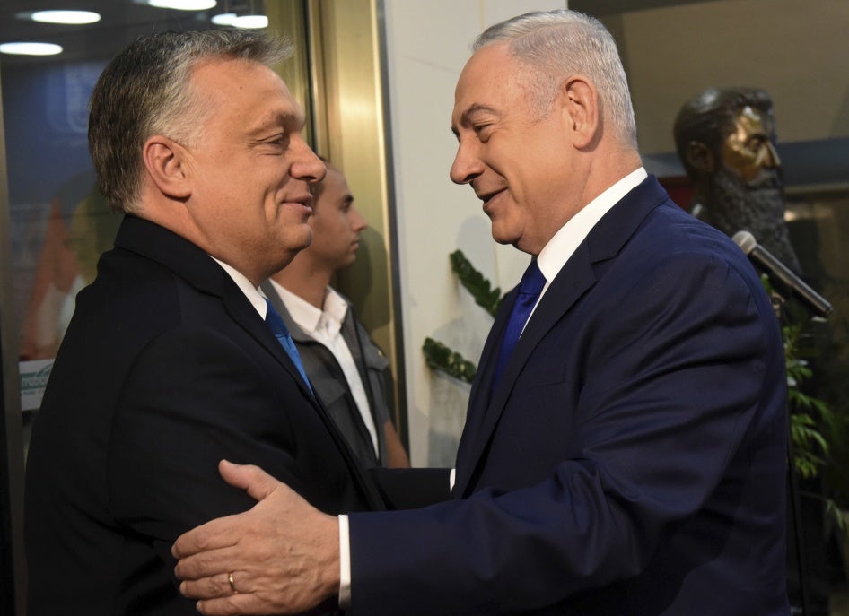 Hungarian Prime Minister Viktor Orban, left, is welcomed by Israeli Prime Minister Benjamin Netanyahu in Jerusalem, July 19, 2018. 