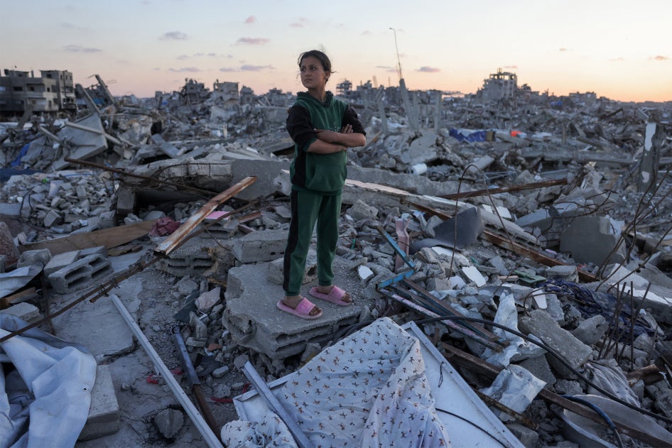 A Palestinian girl stands amidst rubble in Jabalia in the northern Gaza Strip, April 14, 2025.