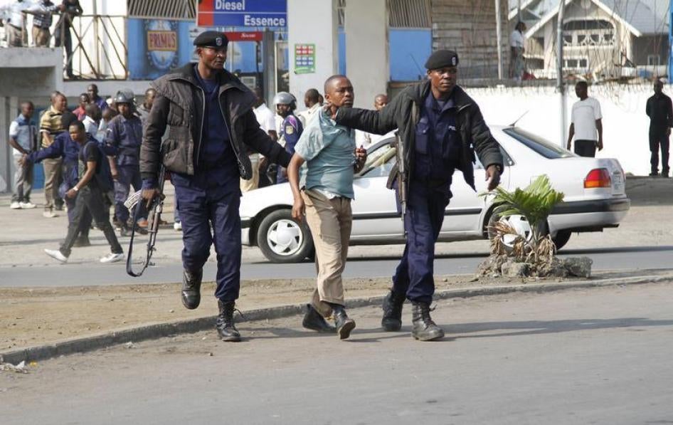 Riot police detain a demonstrator during nation-wide protests against a proposed change in the law that would delay elections. Goma, eastern Democratic Republic of Congo. January 19, 2015.
