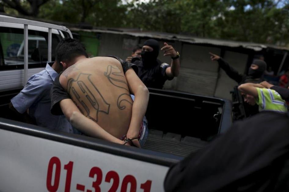 Members of the MS-13 gang are detained near the crime scene where two men, Jose Wilfredo Navidad and Nestor Alexander Rivera, were killed as they rode a motorcycle on their way to work, in San Salvador, El Salvador January 26, 2016.