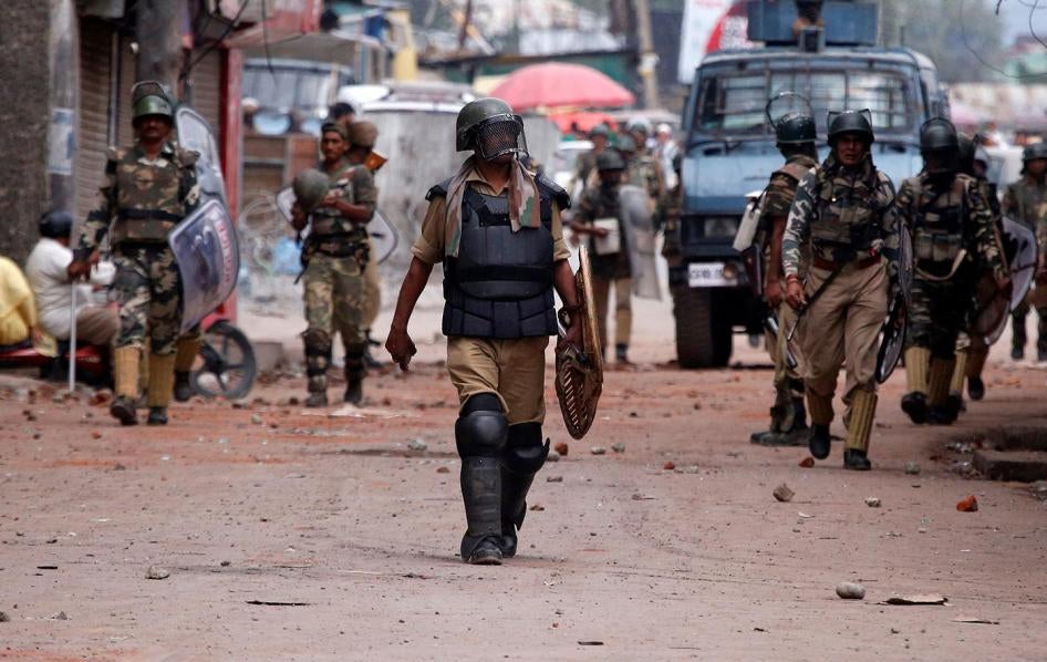 Indian policemen patrol a street following a protest in Srinagar against killings in Kashmir, August 30, 2016.