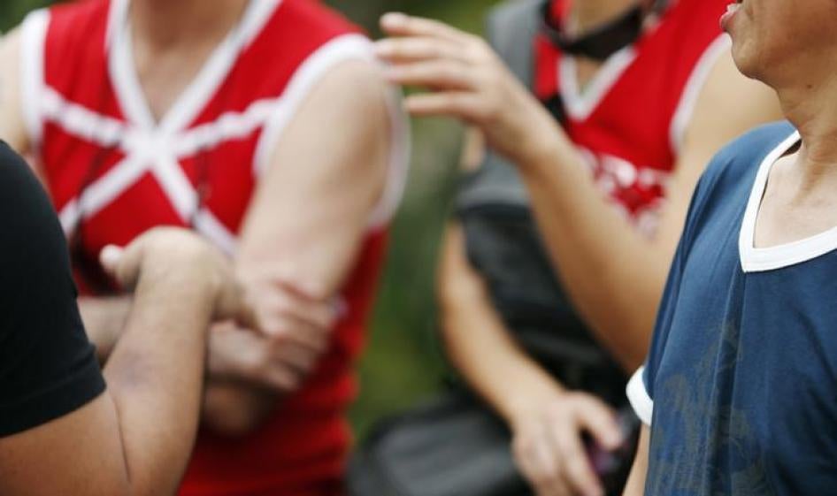 Activists hold a National Wear V-neck Day gathering in response to seminars led by the Malaysian government on “spotting gay symptoms,” in Kuala Lumpur, September 30, 2012.