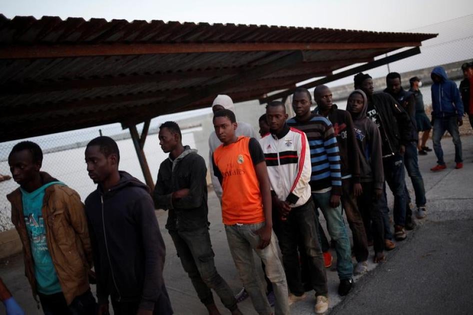 Migrants rescued from a dinghy off the Spanish coast wait to be screened by the Spanish Red Cross at the port in Motril, Spain July 23, 2017. © 2017 Reuters