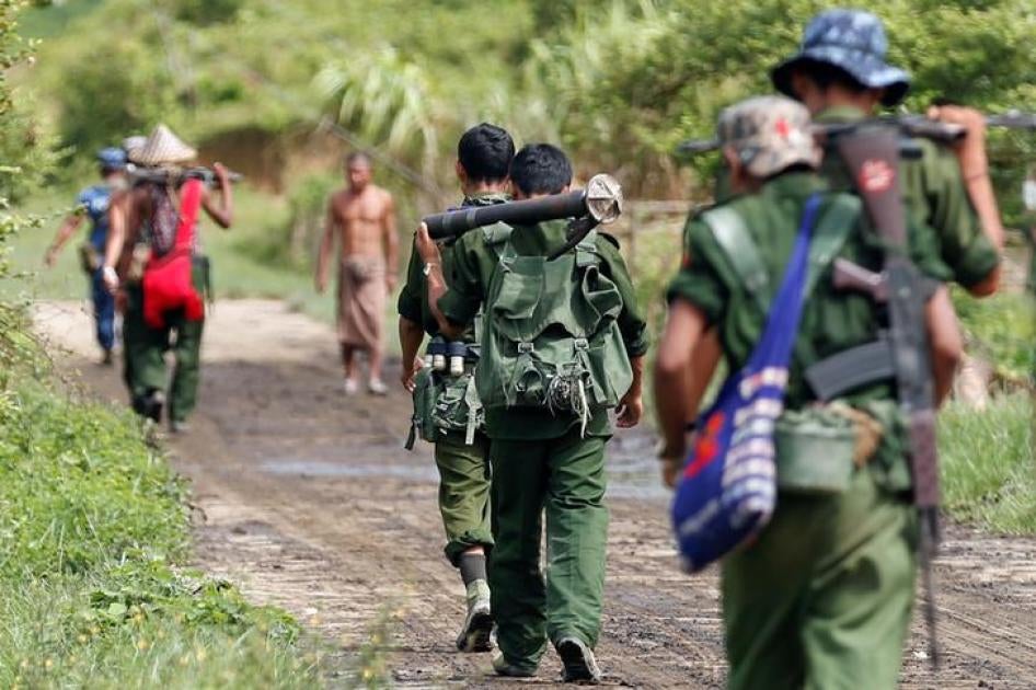 Burmese soldiers patrol a road in Maungdaw, Rakhine State, August 31, 2017.