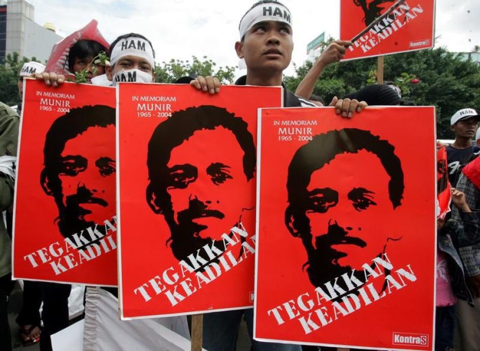 Indonesian protesters hold placards of human rights activists Munir Thalib in Jakarta December 20, 2005.