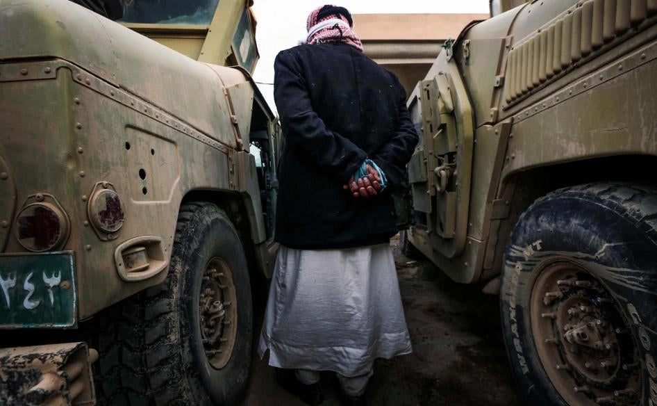 An ISIS suspect held for questioning by Iraqi forces near Mosul.