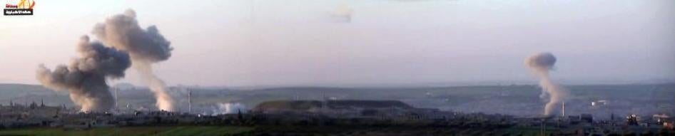 Composite of screenshots from video of the immediate aftermath of the attack during the second fly-over showing four smoke columns. Bellingcat, a group specializing in analyzing information posted online, including videos and photographs, has concluded th