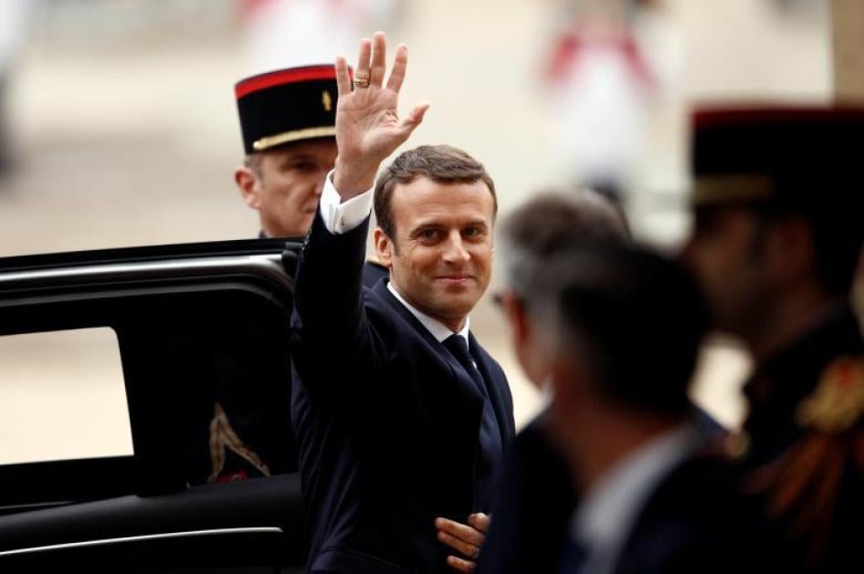 French President-elect Emmanuel Macron waves as he arrives to attend a handover ceremony with outgoing President Francois Hollande at the Elysee Palace in Paris, France, May 14, 2017.