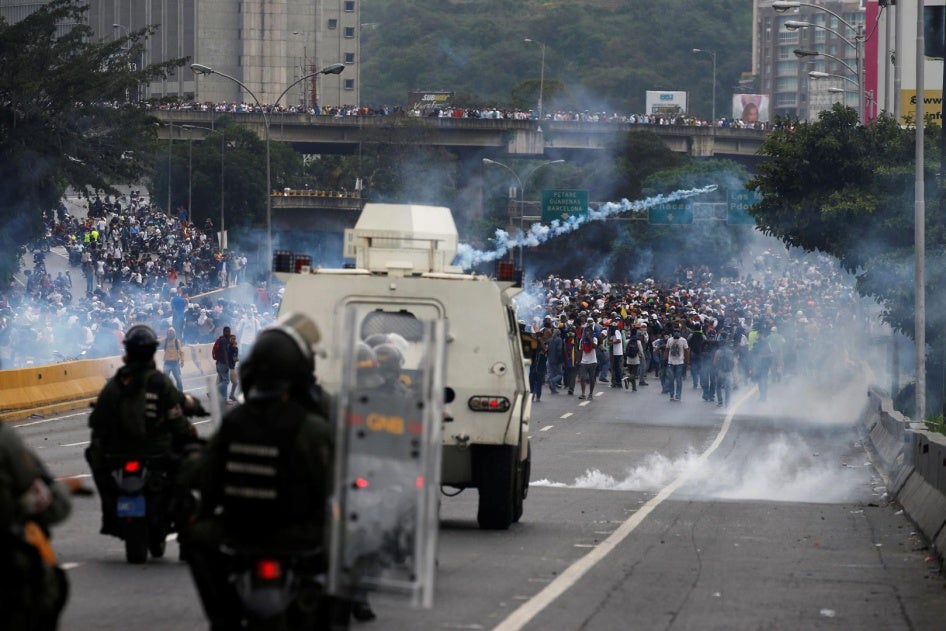 Police fire tear gas toward opposition supporters during clashes while rallying against Venezuela's President Nicolas Maduro in Caracas, Venezuela, April 20, 2017.