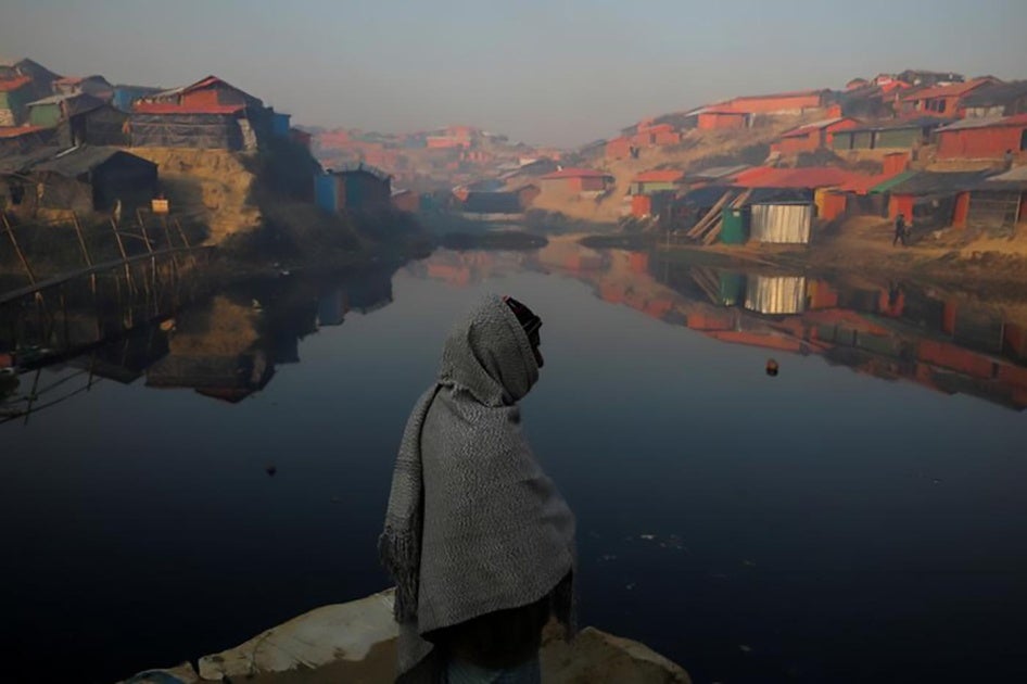 A Rohingya refugee stands next to a pond in the early morning at the Balukhali refugee camp near Cox's Bazar, Bangladesh December 26, 2017. REUTERS/Marko Djurica TPX IMAGES OF THE DAY