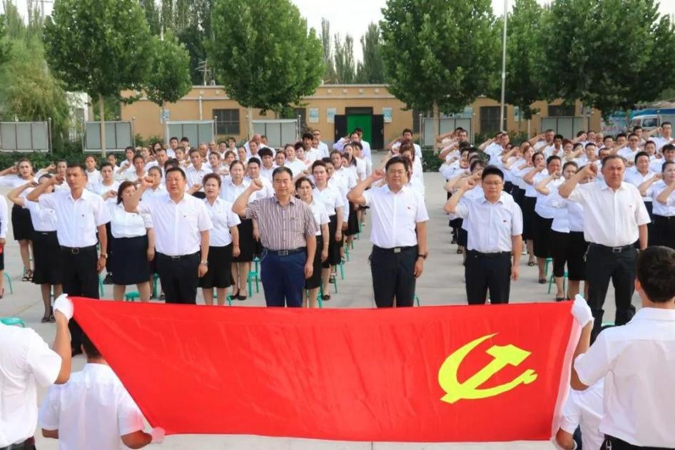 Village officials swear allegiance to the Chinese Communist Party in Kashgar, Xinjiang. 