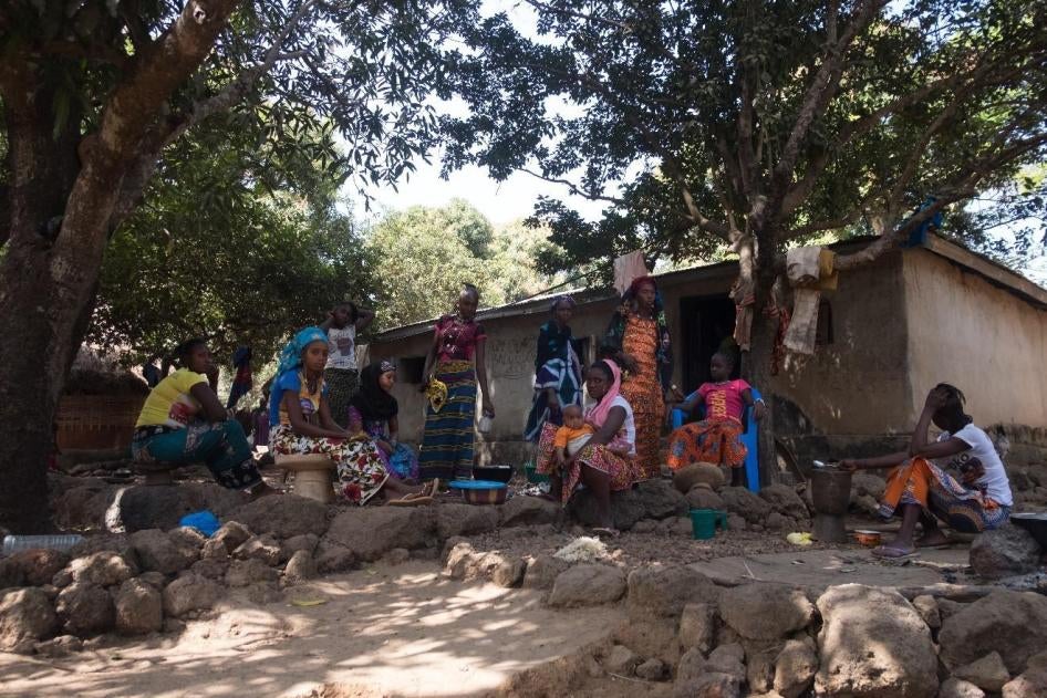 Women prepare food in Hamdallaye village in the Boké region. Compensation payments for land lost to mining are often paid to male heads of household or linages, even where the land is utilized by entire families or households. January 2018. 