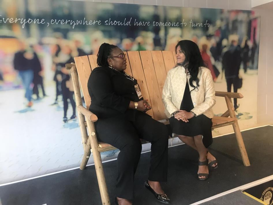Two women sitting on a bench