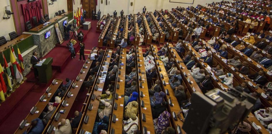 Abiy Ahmed, left, the newly elected chair of the Ethiopian Peoples' Revolutionary Democratic Front (EPRDF) addresses Ethiopian lawmakers after he was sworn in as the country's Prime Minister, Monday, April 2, 2018.
